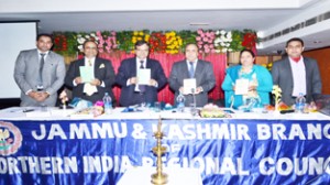 Principal Accountant General (Audit) Dr Subhash Chandra alongwith other dignitaries releasing directory of CAs of J&K at Jammu on Tuesday.