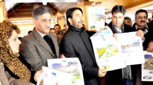 Minister for Tourism Ghulam Ahmad Mir releasing calendars at Srinagar on Saturday.
