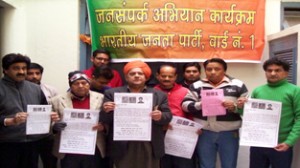 MLA Ashok Khajuria and others releasing pamphlet at Jammu on Sunday.