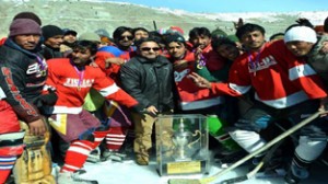 Players of City Club Drass posing for a group photograph after lifting the CEC Ice Hockey Cup in Kargil.