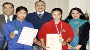 Skater Nikita Thakur and fencer Priya Khajuria posing alongwith Navin Agarwal, DG Sports and other dignitaries in Jammu.