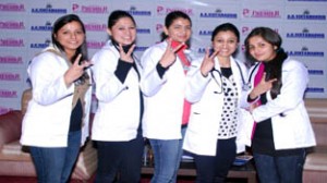 JKCET toppers showing victory signs while posing for a photograph during felicitation function.