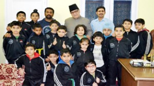 Minister for Higher Education Mohammad Akbar Lone posing alongwith budding karatekas selected for International Championship.