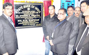 S K Kapoor, Regional Head, SBI J&K and others introducing new machine in Kathua on Sunday.