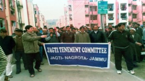 Inmates of Jagti Township holding protest under the banner of Jagti Tenement Committee on Sunday.