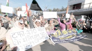 PoK refugees holding a protest dharna near Press Club Jammu on Friday. -Excelsior/Rakesh