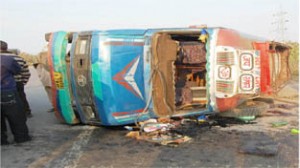 A mini bus carrying school children which rolled down near Kalibari on Jammu-Pathankot Highway on Thursday.  	-Excelsior/Magotra