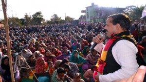 MLA Balwant Singh Mankotia addressing public meeting in Jib Thathi area of Udhampur on Sunday. 