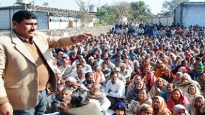 Labba Ram Gandhi addressing West Pak refugees at Swankha Morh on Sunday.     	     -Excelsior/ Gautam