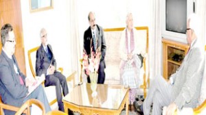 Governor N N Vohra interacting with IRCS members at Raj Bhavan on Thursday.