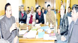 Minister of State for Industries , Sajjad Ahmed Kitchloo chairing a meeting at Jammu on Tuesday.