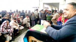 Minister of State for Health Shabir Ahmad Khan addressing public gathering at Rajouri on Friday.