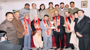 Divisional Commissioner Jammu, Shantmanu presenting award of honour to Anil K Padha at Red Cross Bhawan Jammu.
