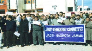 Migrants protesting at Jagti township on Sunday.