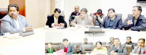 Minister for Housing and Culture Raman Bhalla chairing a meeting at Jammu on Friday.