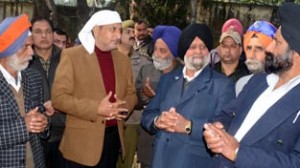 Minister for PHE, Sham Lal Sharma interacting with Sikh Sangat on eve of birth anniversary of Guru Govind Singh Ji at Akhnoor on Sunday.