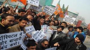 BJYM activists protesting in front of Super Specialty Hospital Jammu on Thursday.     —Excelsior/Rakesh