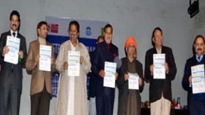 Minister for PHE Sham Lal Sharma, Minister for Housing Raman Bhalla, MP Madan Lal Sharma and others releasing brochure during awareness programme at Jammu on Friday.