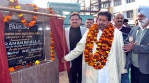 Minister for Housing Raman Bhalla inaugurating parking lot at JU on Thursday.