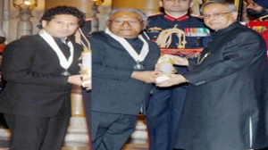 President Pranab Mukherjee conferring Bharat Ratna Award - 2014 to cricketer Sachin Tendulkar and Prof CNR Rao at Rashtrapati Bhavan in New Delhi on Tuesday. (UNI)