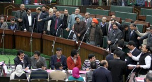 Opposition members protesting in Assembly before staging a walkout on Monday.—Excelsior/Rakesh