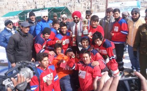 J&K Red team posing for a photograph alongwith the dignitaries after lifting the title trophy of National Jr Ice Hockey Championship.