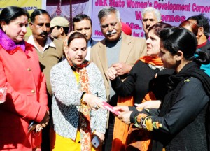 Minister for Social Welfare Sakina Itoo distributing cheque to a loanee at Jammu on Wednesday.