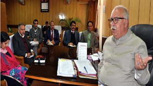 Minister for Roads & Buildings Abdul Majid Wani chairing a meeting at Jammu on Monday.