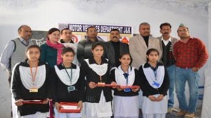 Winners of Debate Competition posing alongwith dignitaries at GGHSS in Reasi.