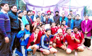 Jubilant Jammu district team posing for a group photograph alongwith chief guest, Devender Singh Rana in Jammu on Sunday.