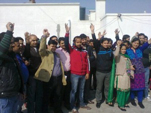 Employees of JKSACS raising slogans during protest at Jammu on Friday.