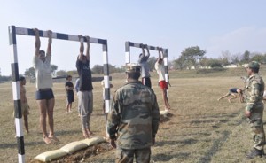Youth displaying their physical fitness at Army recruitment rally in Jammu.