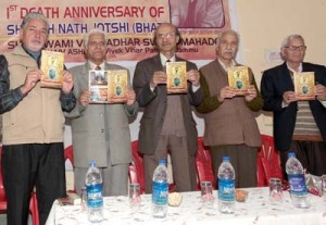 Eminent poet and physician, Dr KL Chaudhary and other dignitaries releasing souvenir on the noted Shaiva scholar V N Jotshi in Jammu on Sunday. -Excelsior/ Rakesh
