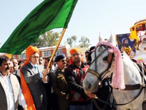 Chief Minister Omar Abdullah flagging off Guru Ravi Dass devotees rally at Jammu on Wednesday.