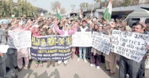 PoJK refugees holding protest rally near Press Club in Jammu on Saturday. -Excelsior/ Rakesh 