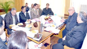 Minister for Roads and Buildings Abdul Majid Wani chairing a meeting at Jammu on Monday.