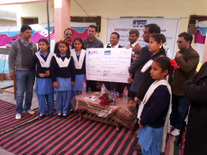 Students and the dignitaries during distribution of scholarships by NHPC in Jammu.