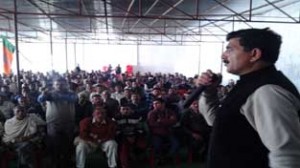 Jugal Kishore Sharma addressing a public meeting at Khour on Sunday.