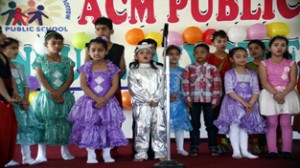 Kids of ACM Public School presenting group song during annual day celebration on Tuesday.
