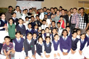 Winners of 10th J&K State Wushu Championship posing for photograph with dignitaries at Indoor Hall, MA Stadium on Saturday.