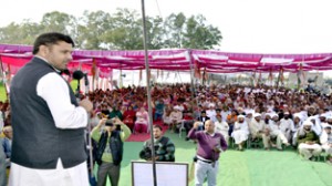 MP Madan Lal Sharma addressing public meeting at Kotli Shah in RS Pura on Sunday.