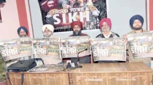 Officials of Shan-e-Khalsa Productions releasing posters of ‘Proud to be a Sikh’ at Jammu on Tuesday.     -Excelsior/Rakesh