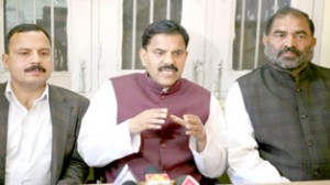 NPP chairman Harshdev Singh addressing press conference at Jammu on Friday. -Excelsior/ Rakesh