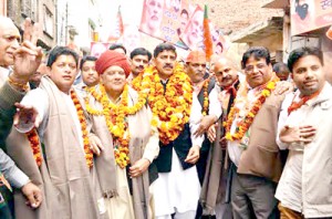 BJP leaders during a road show at Jammu on Friday. -Excelsior/Rakesh