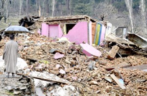 Debris of a house which was completely damaged in a landslide in Baramulla on Friday.   -Excelsior/Aabid Nabi