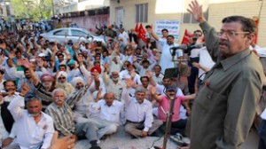 Low paid employees leader Abdul Majid Khan addressing May Day rally in Jammu on Tuesday. -Excelsior/Rakesh