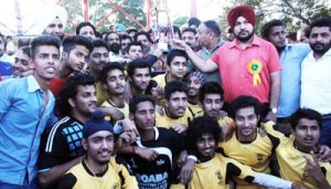 Winners Sainik Colony Football Club posing for a group photograph alongwith the chief guest Raman Bhalla, Minister for Sports in Jammu on Sunday.             -Excelsior/Rakesh      