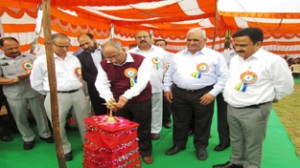 Secretary Technical Education and Youth Services and Sports, Pervaiz Ahmed Malik lighting traditional lamp to inaugurate Abhishek Memorial Annual Sports Meet.