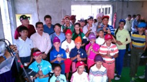 Young golfers posing alongwith Divisional Commissioner Jammu, Shantmanu and other dignitaries at Sidhra Golf Course in Jammu.