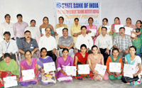 Students displaying certificates during valedictory programme State Bank of India Rural Self Employment Training Institute Kathua.